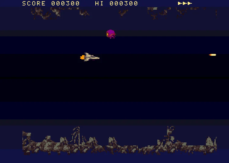 Le shoot'em up « Caverne extraterrestre » tourne dans WinUAE sur un Amiga 1200 émulé : vaisseau, ennemi et décor de caverne